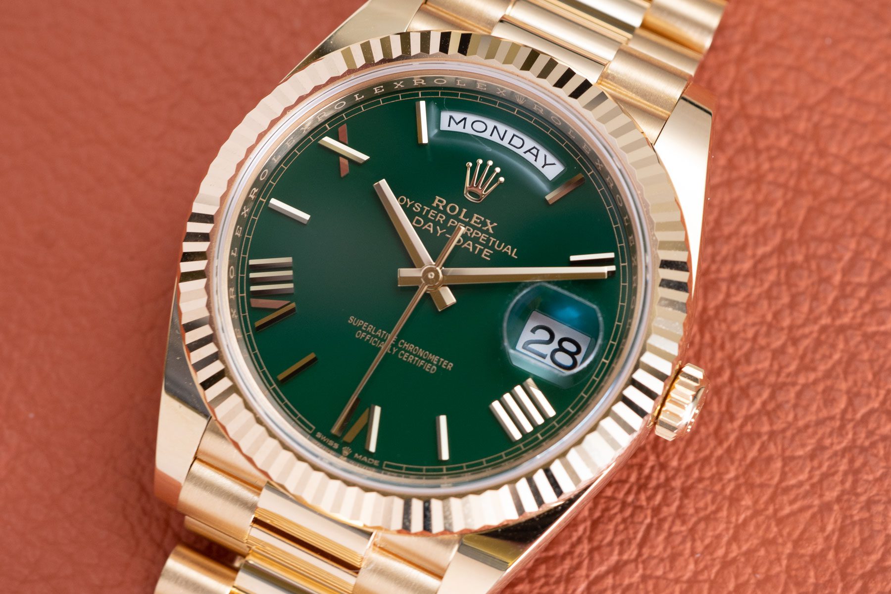 A collection of luxury replica watches including Rolex, Omega, and Tag Heuer, displayed elegantly on a velvet stand, emphasizing their detailed craftsmanship.
