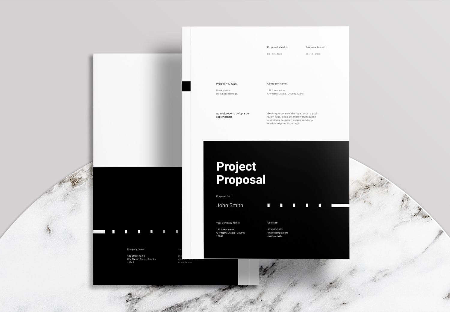 A selection of modern and diverse InDesign project proposal templates displayed on a table.