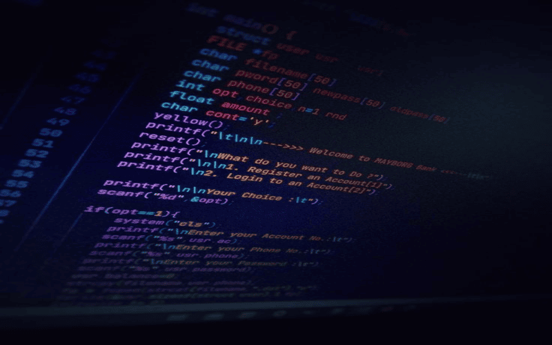 A modern web developer enthusiastically exploring ARIA features on a laptop in a bright and organized workspace.